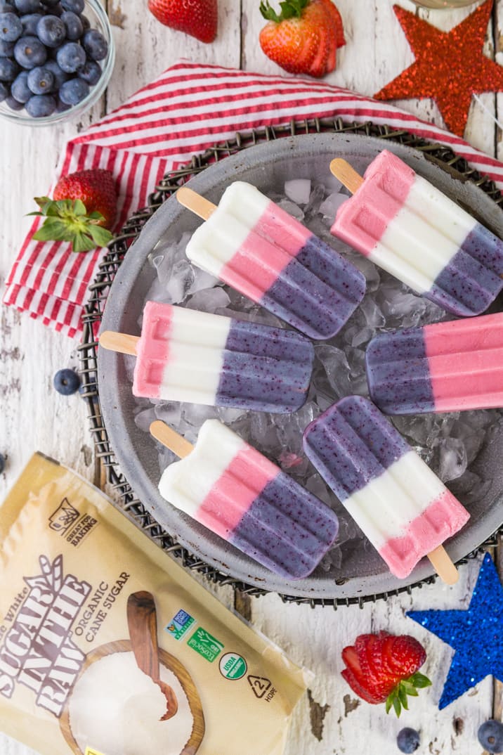Red White and Blue Smoothie Pops! These popsicles are perfect for the 4th of July or Memorial Day! Celebrate USA with these easy red white and blue pops, so fun!